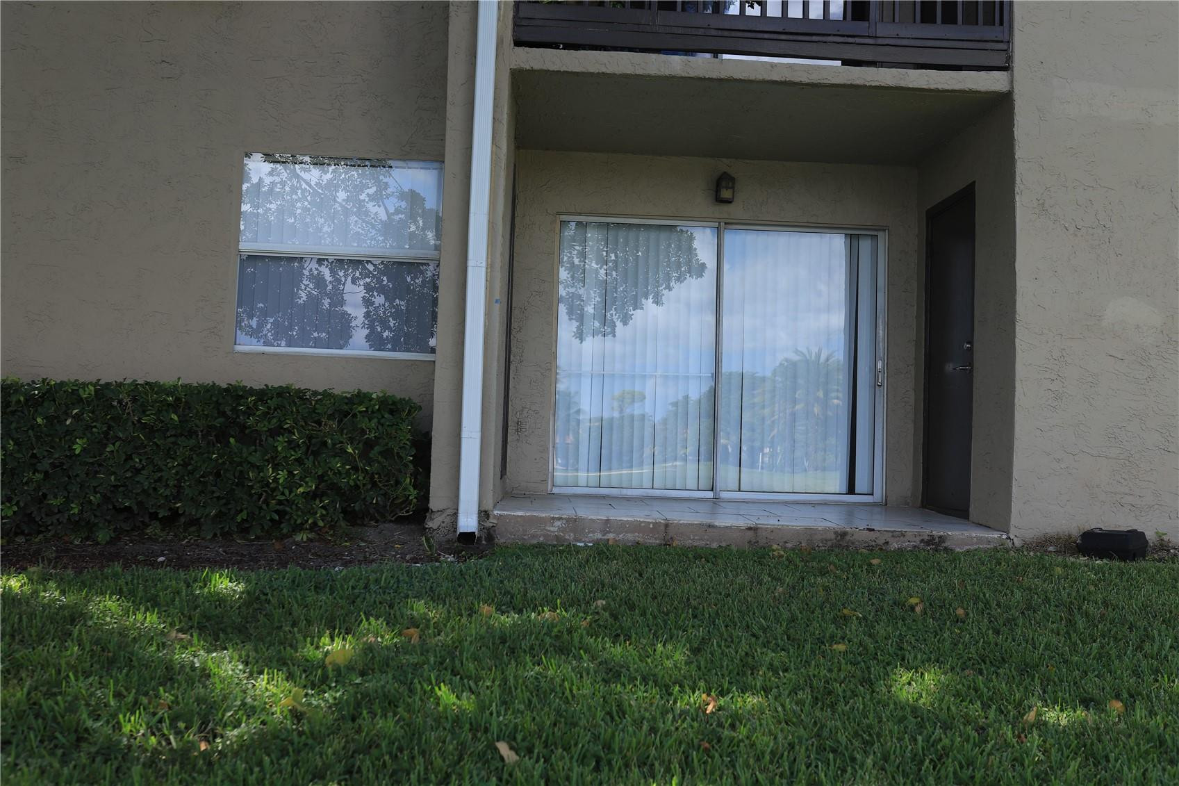 231 Southwest 113th Way, Unit 231 Pembroke Pines, FL 33025 - Photo 20 of 26 a view of porch with a yard