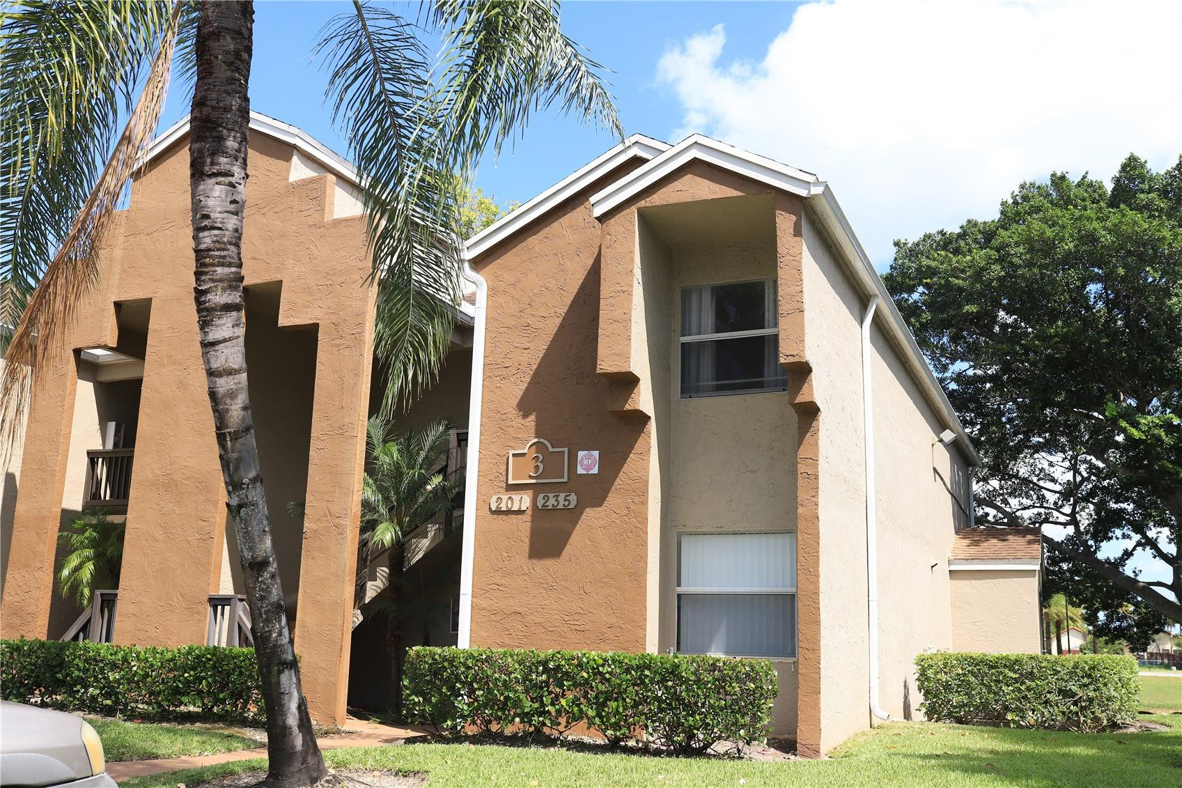 231 Southwest 113th Way, Unit 231 Pembroke Pines, FL 33025 - Photo 2 of 26 a front view of a house with a yard