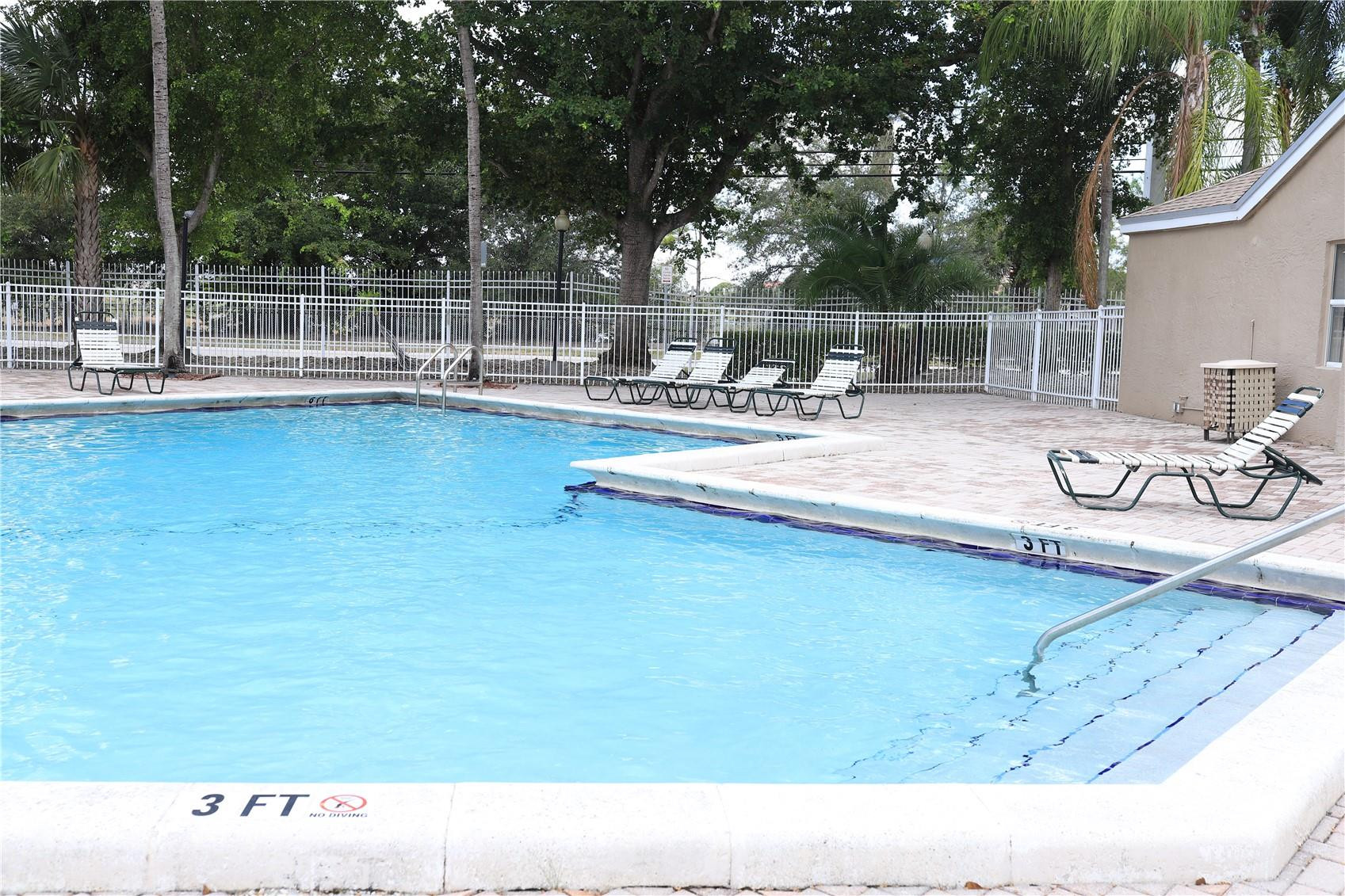 231 Southwest 113th Way, Unit 231 Pembroke Pines, FL 33025 - Photo 25 of 26 a view of a swimming pool with outdoor seating