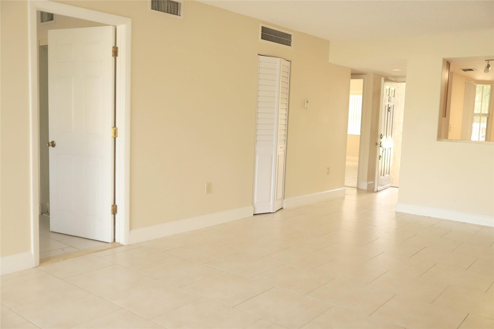 231 Southwest 113th Way, Unit 231 Pembroke Pines, FL 33025 - Photo 10 of 26 a view of empty room with wooden floor