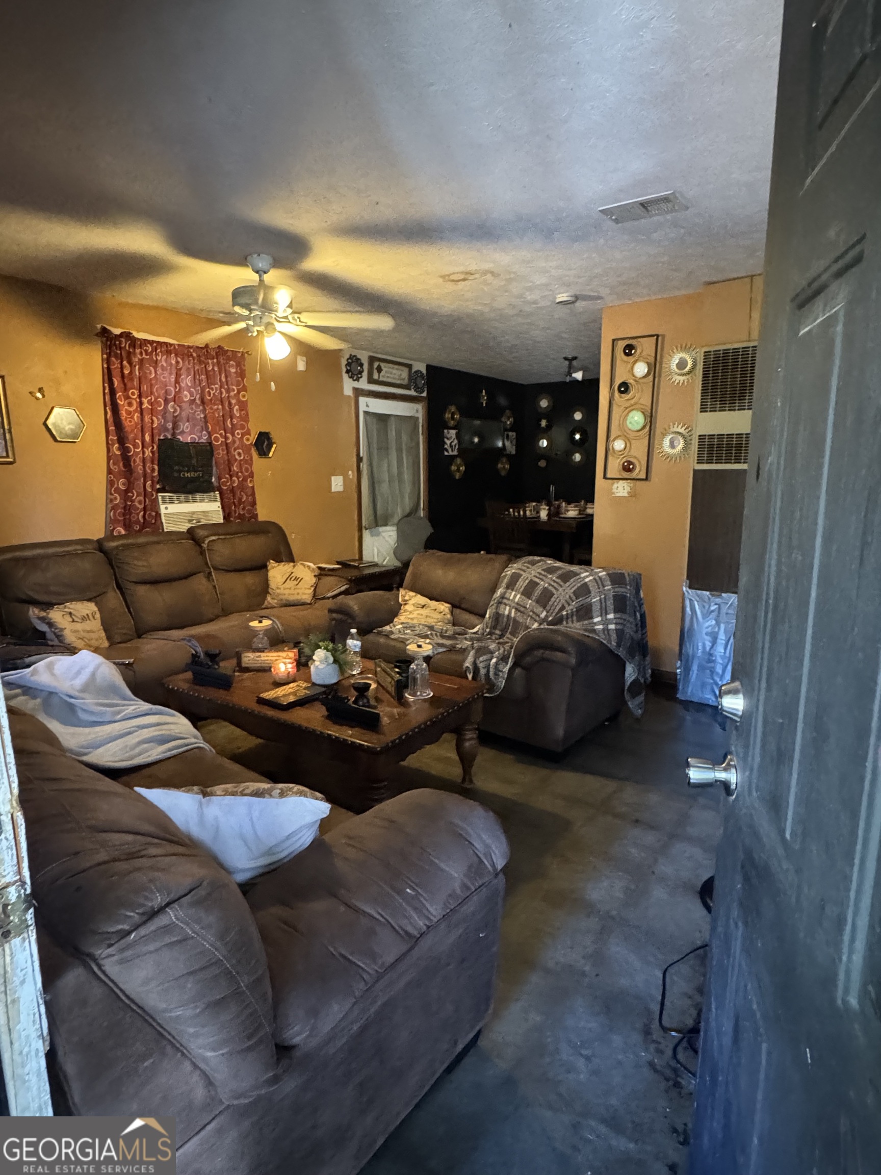 406 South Hampton Street Americus, GA 31709 - Photo 3 of 9 a bedroom with furniture and a large window