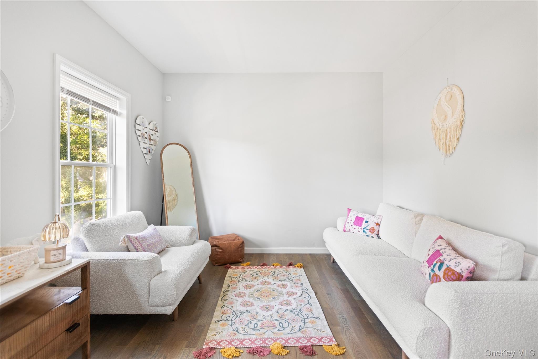 24 Belmont Road Sound Beach, NY 11789 - Photo 11 of 23 a living room with furniture and a window