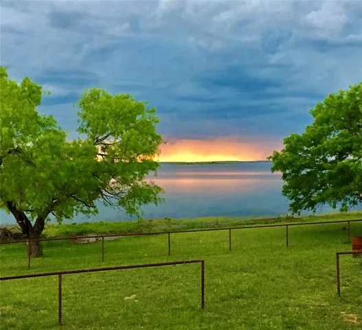 a view of a golf course with a lake