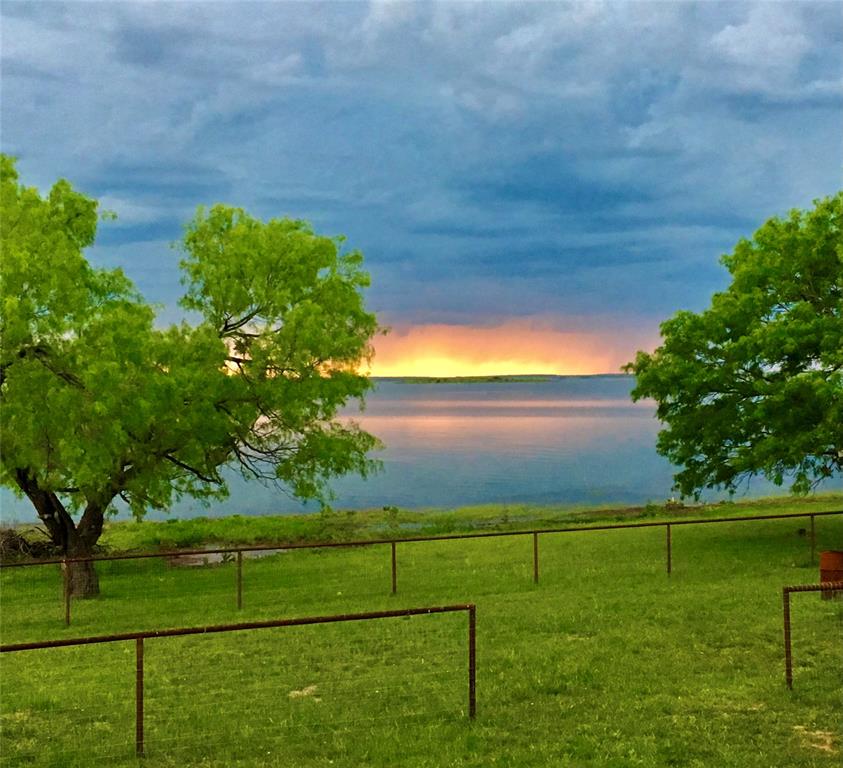 4942 County Road 206 Breckenridge, TX 76424 - Photo 11 of 40 a view of a golf course with a lake