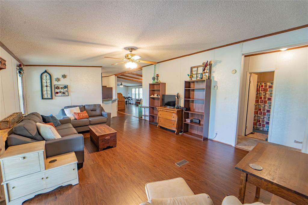 4942 County Road 206 Breckenridge, TX 76424 - Photo 13 of 40 a living room with furniture and wooden floor