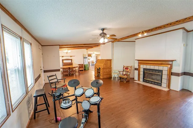 a view of a livingroom with furniture and a fireplace