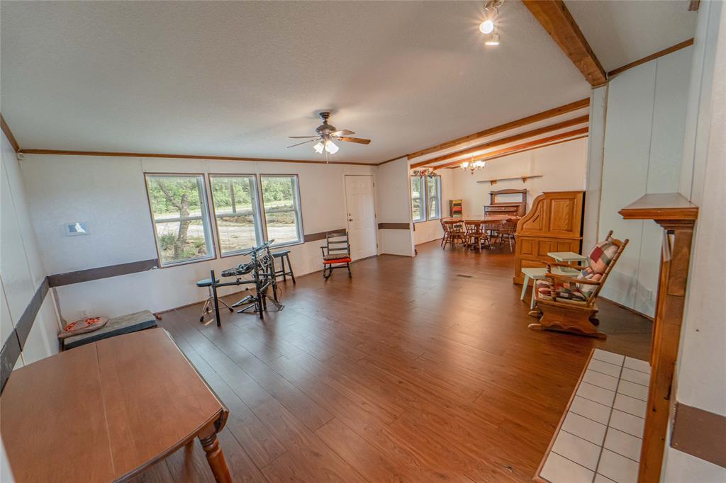 4942 County Road 206 Breckenridge, TX 76424 - Photo 15 of 40 a living room with furniture and a large window