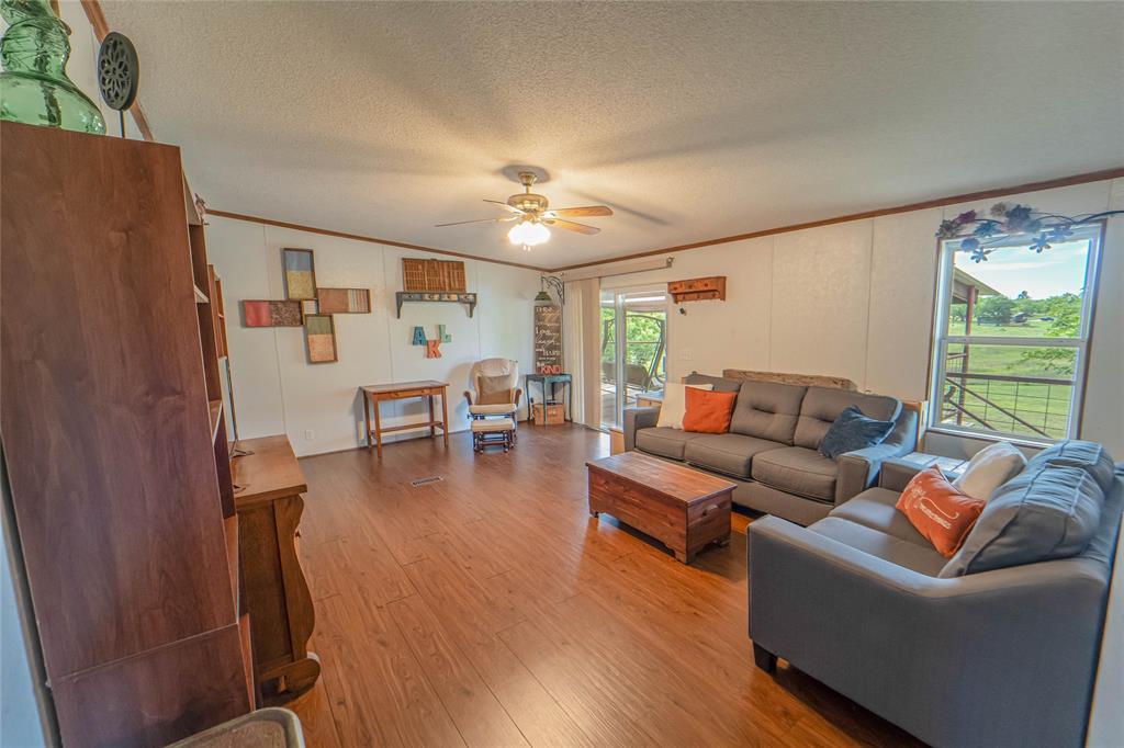 4942 County Road 206 Breckenridge, TX 76424 - Photo 21 of 40 a living room with furniture and a large window
