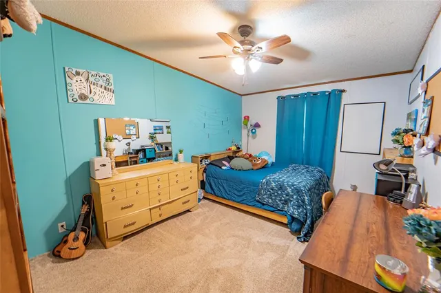 a view of walk in closet with clothes