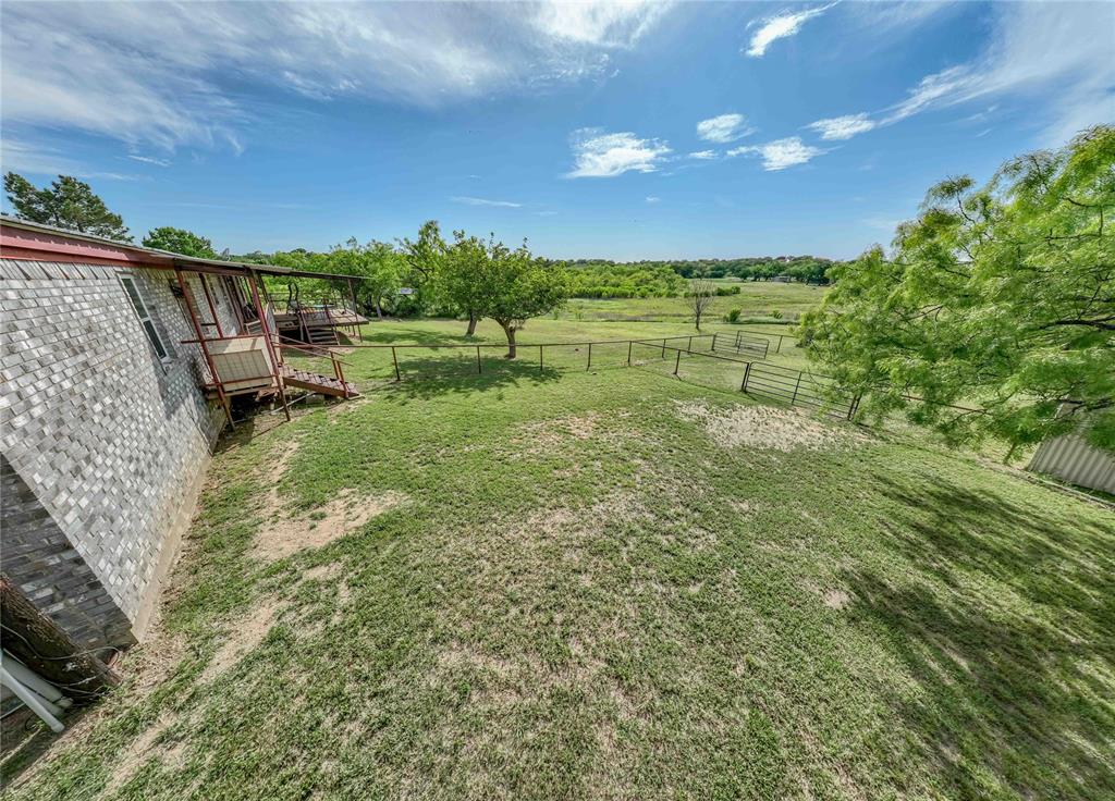 4942 County Road 206 Breckenridge, TX 76424 - Photo 37 of 40 a view of a yard with an outdoor seating