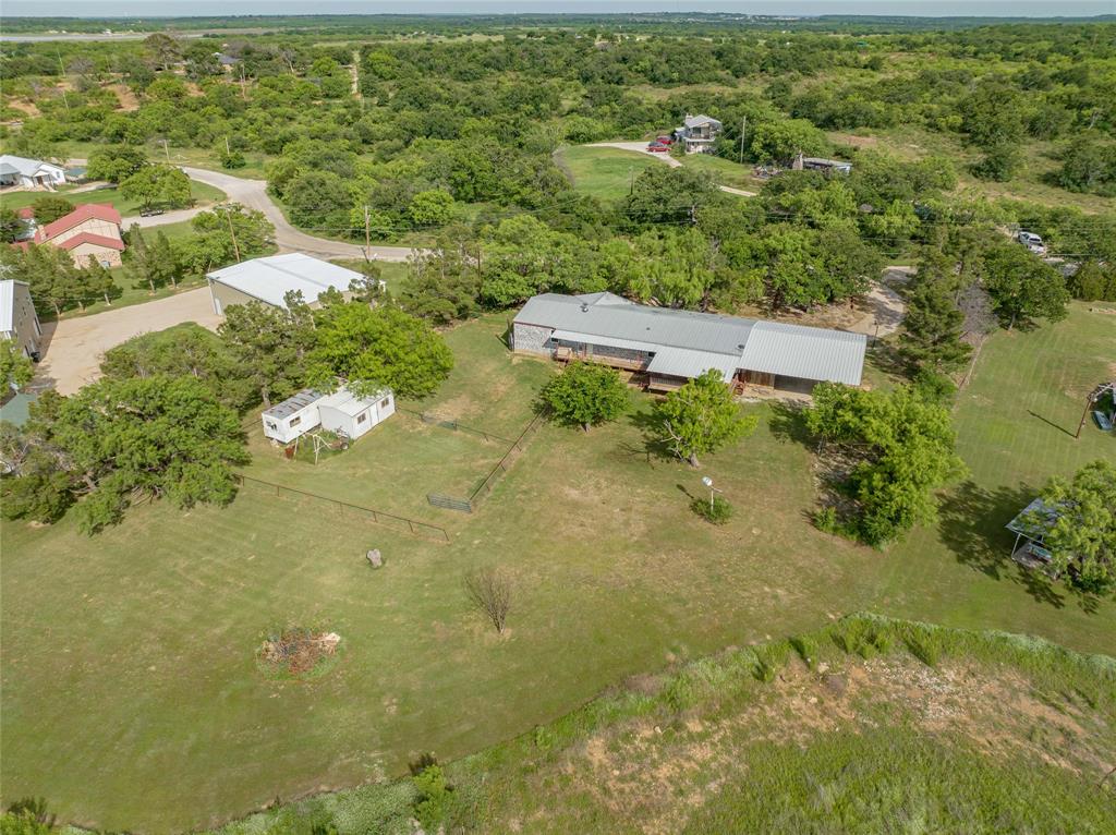 4942 County Road 206 Breckenridge, TX 76424 - Photo 6 of 40 an aerial view of residential houses with outdoor space and trees
