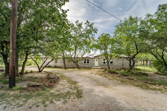 a view of a house with a tree