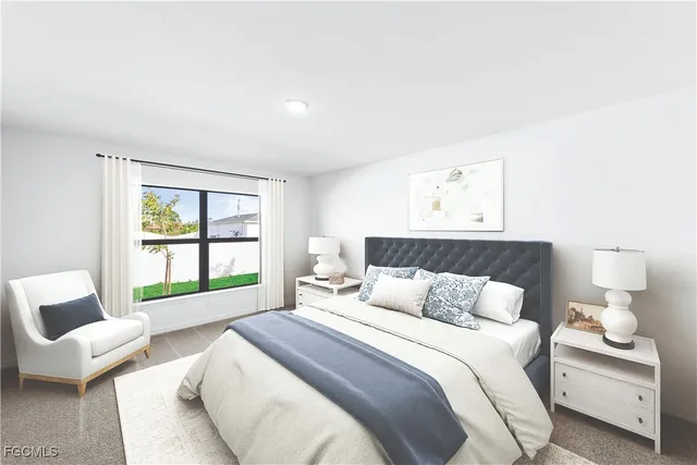 a bedroom with a bed and a large window