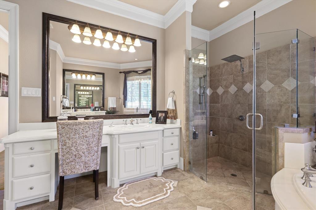 2021 Kings Pass Heath, TX 75032 - Photo 17 of 37 a bathroom with a sink a toilet and shower