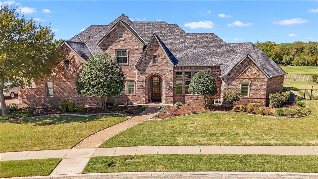 2021 Kings Pass Heath, TX 75032 - Photo 2 of 37 a front view of a house with swimming pool having outdoor seating