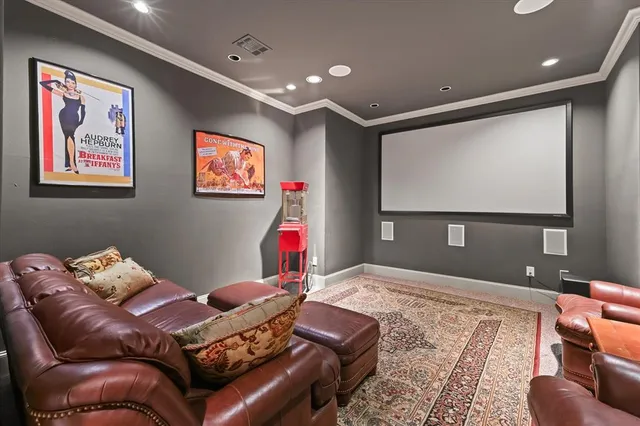 a bedroom with furniture and a flat screen tv