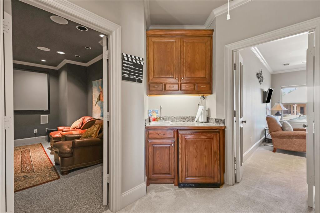 2021 Kings Pass Heath, TX 75032 - Photo 24 of 37 a living room with furniture and a chandelier