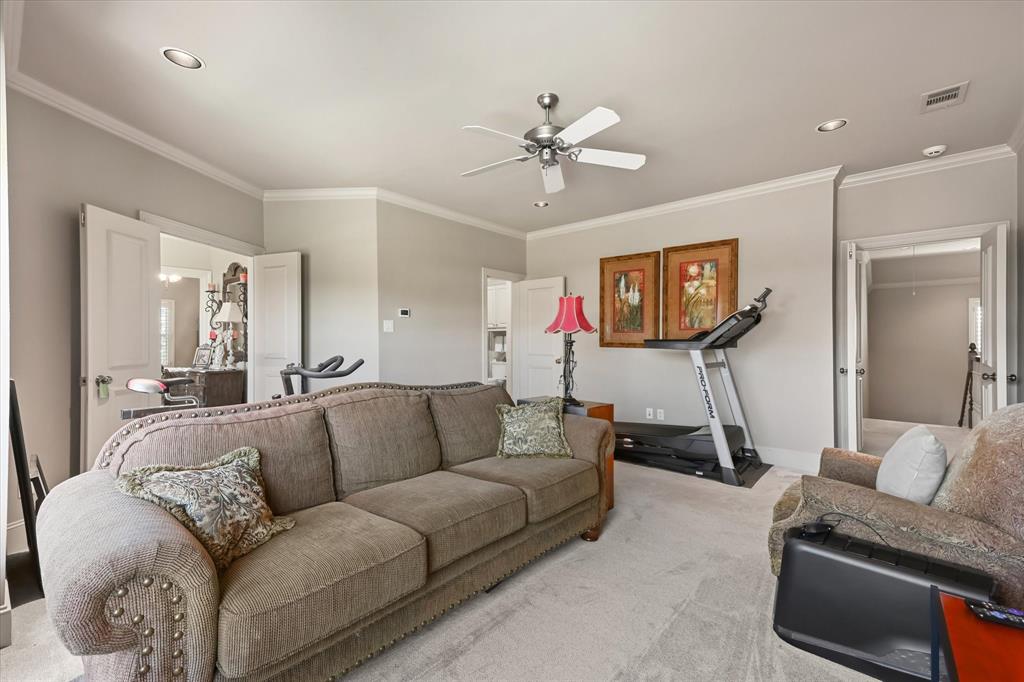 2021 Kings Pass Heath, TX 75032 - Photo 25 of 37 a living room with furniture and a flat screen tv