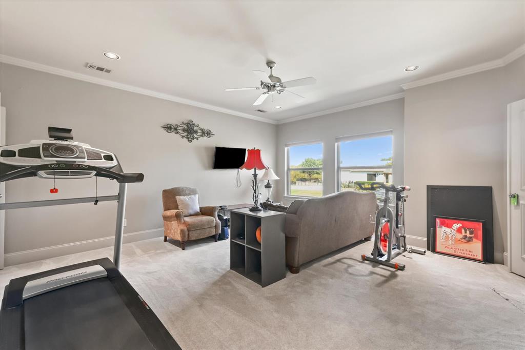 2021 Kings Pass Heath, TX 75032 - Photo 26 of 37 a living room with furniture and a flat screen tv
