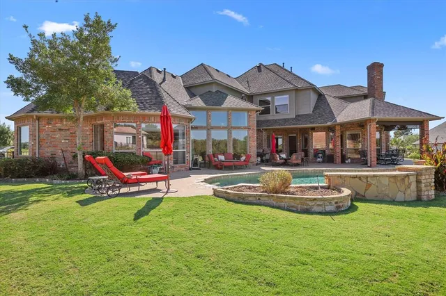 a building outdoor space with patio furniture and white walls