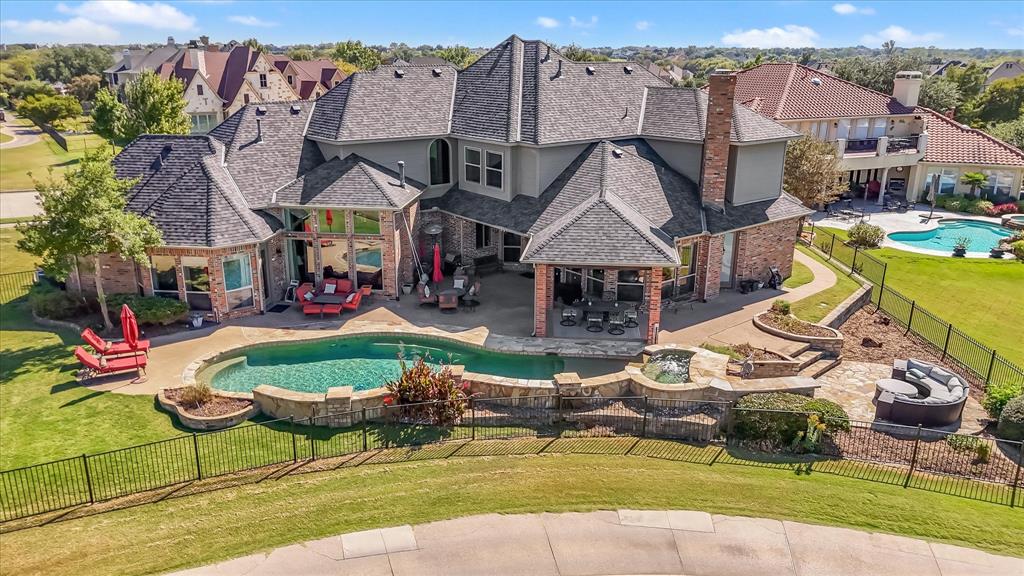2021 Kings Pass Heath, TX 75032 - Photo 33 of 37 an aerial view of a house with garden space and houses