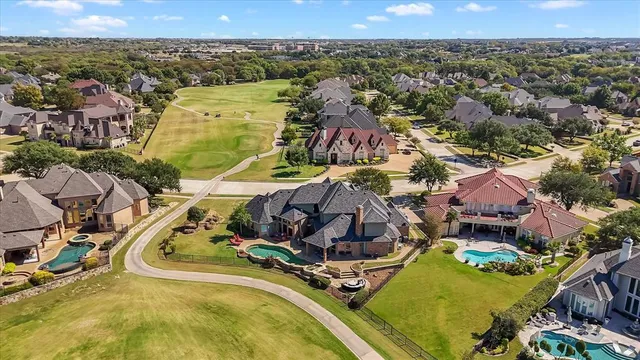 an aerial view of a house with a swimming pool
