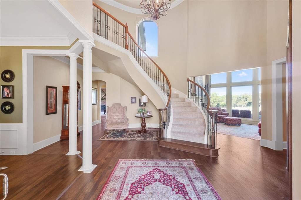 2021 Kings Pass Heath, TX 75032 - Photo 5 of 37 a view of entryway and hall with wooden floor