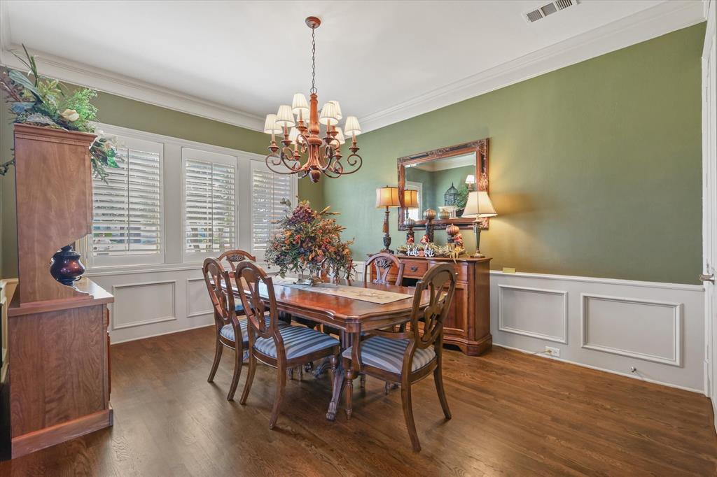 2021 Kings Pass Heath, TX 75032 - Photo 8 of 37 a view of a dining room with furniture window and wooden floor