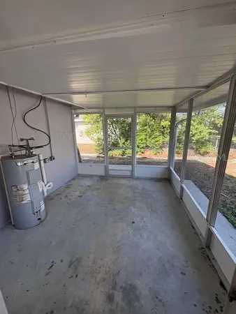 a view of a room with wooden floor and outdoor seating