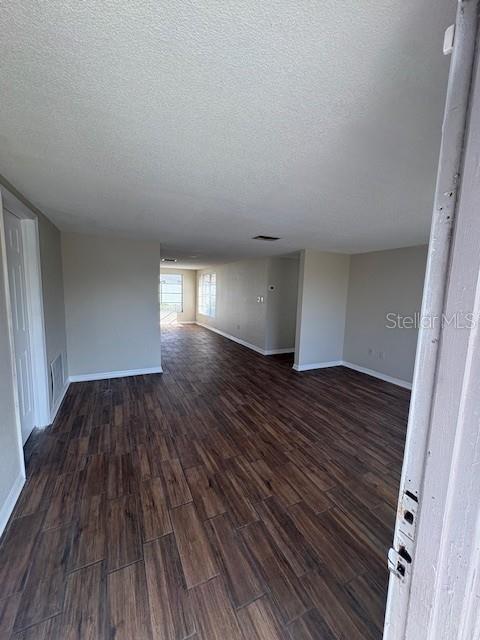 7839 Canna Drive Port Richey, FL 34668 - Photo 2 of 12 a view of empty room with wooden floor