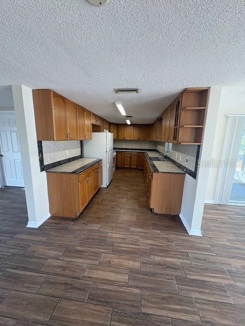 7839 Canna Drive Port Richey, FL 34668 - Photo 4 of 12 a room with wooden floors and furniture