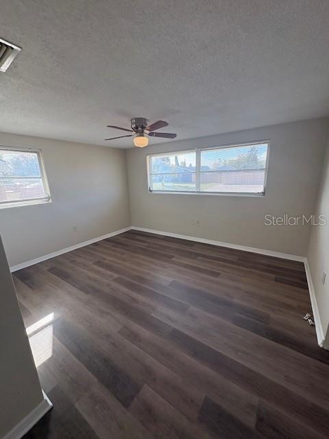 7839 Canna Drive Port Richey, FL 34668 - Photo 10 of 12 wooden floor in an empty room