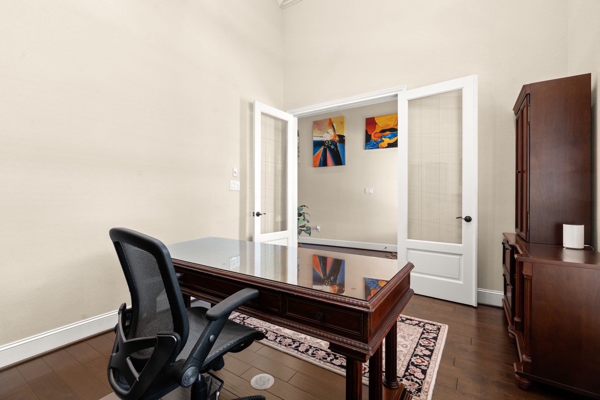 107 Elk Run Court Conroe, TX 77384 - Photo 11 of 50 Features sleek hardwood floors, stylish glass French doors.