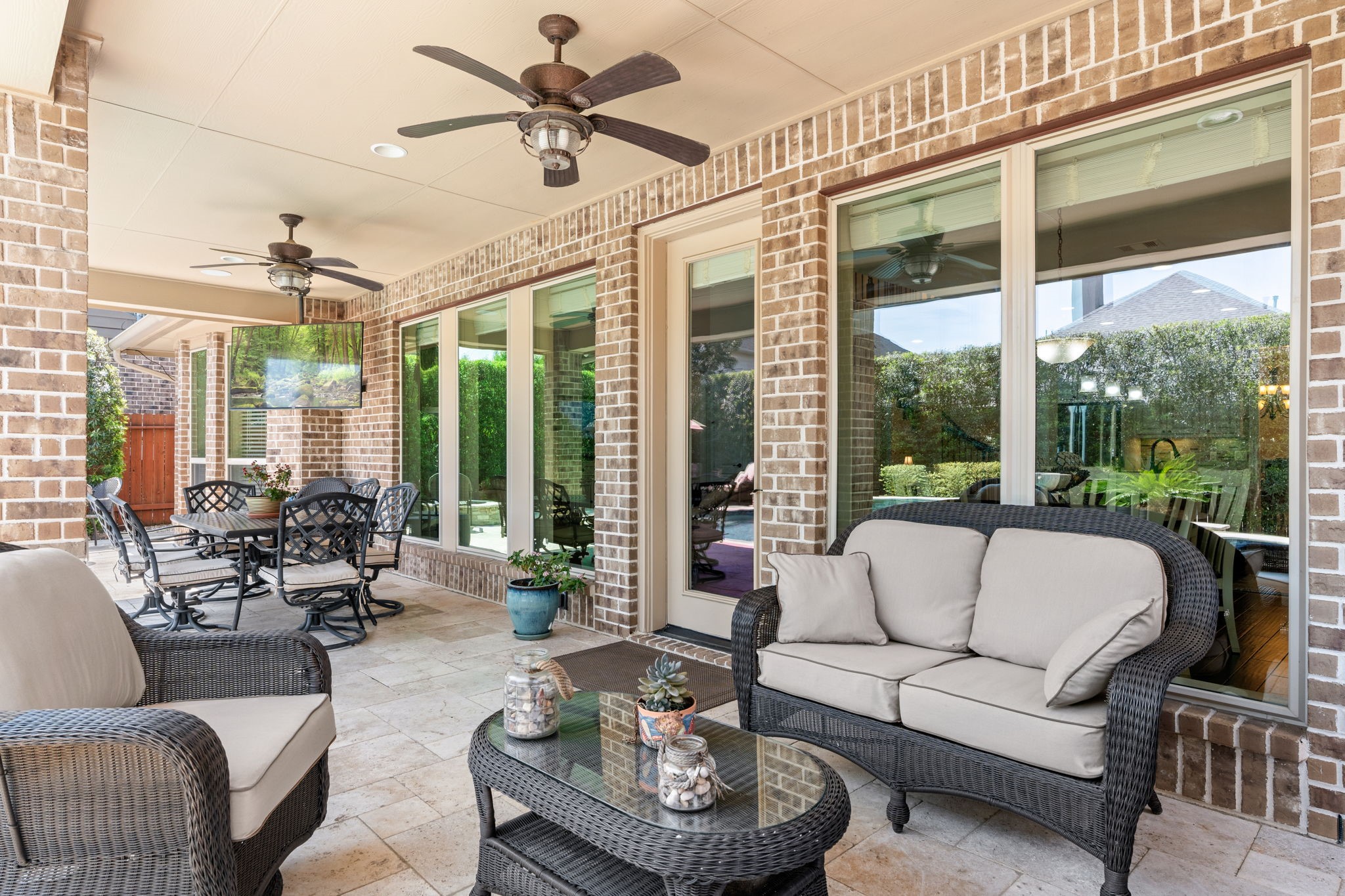 107 Elk Run Court Conroe, TX 77384 - Photo 7 of 50 Oversized, extended cover patio perfect for relaxing and entertaining in style.
