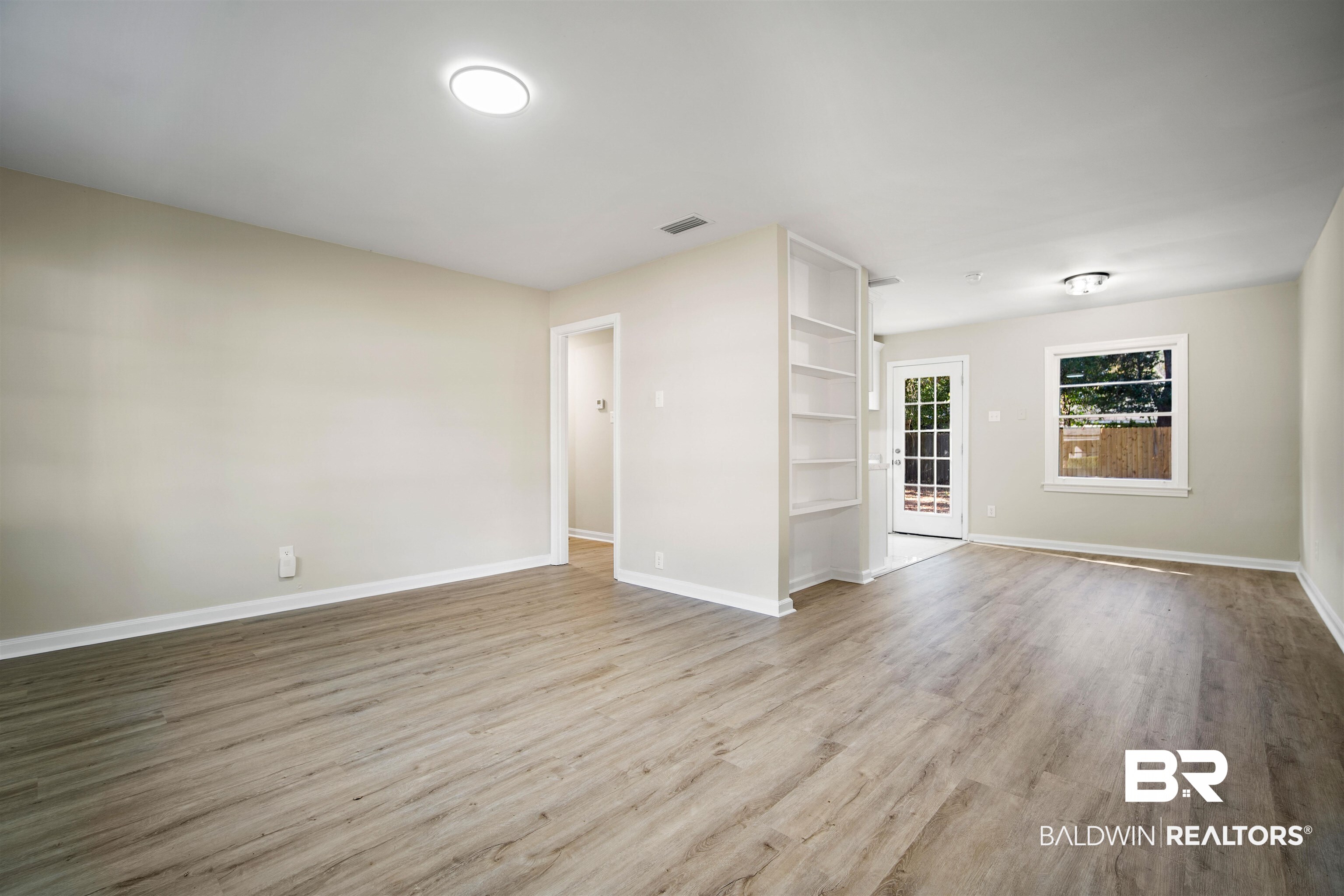 662 Merritt Drive Mobile, AL 36609 - Photo 6 of 21 Unfurnished living room featuring light hardwood / wood-style floors