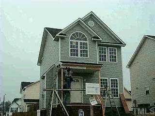 4408 Windstorm Way Raleigh, NC 27616 - Photo 1 of 1 a front view of a house with many windows
