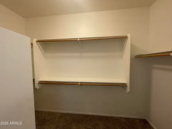 a bathroom with a bathtub sink and mirror