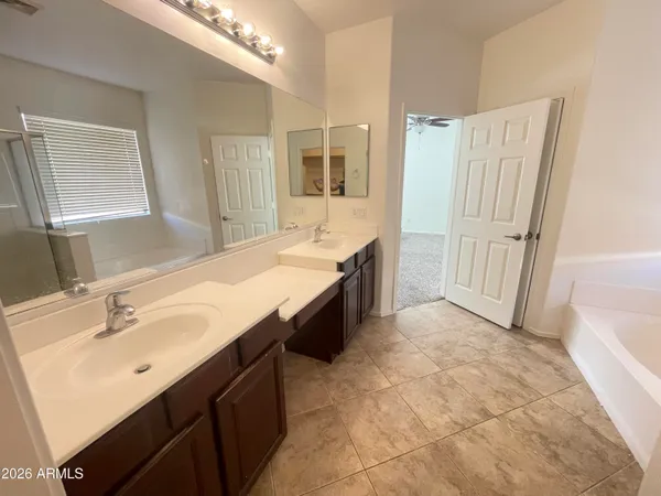 a view of kitchen with white cabinets