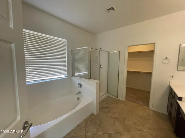 a view of kitchen with white cabinets