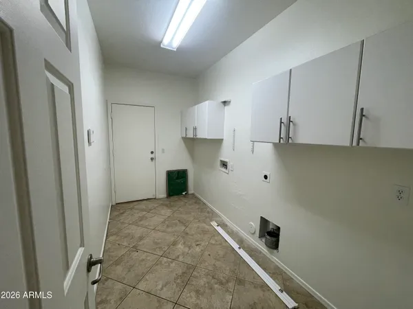 a view of front door and small yard