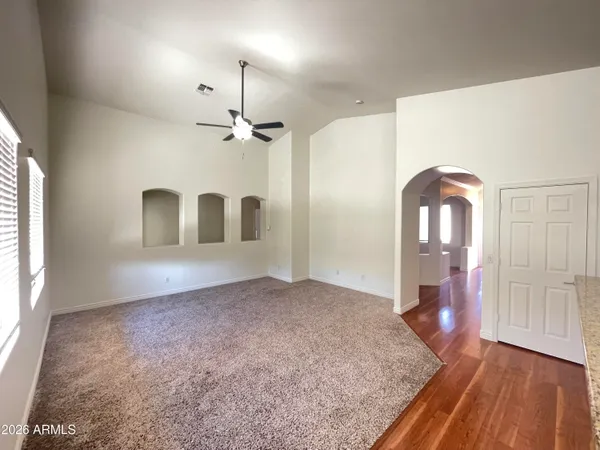 a view of an empty room with windows