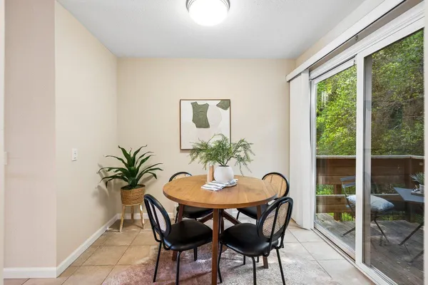 a dining room with furniture and window