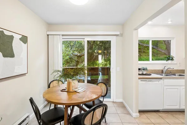 a view of a dining room with furniture window and outside view