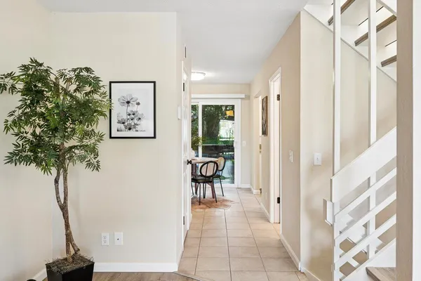 a view of a hallway with paintings on the wall