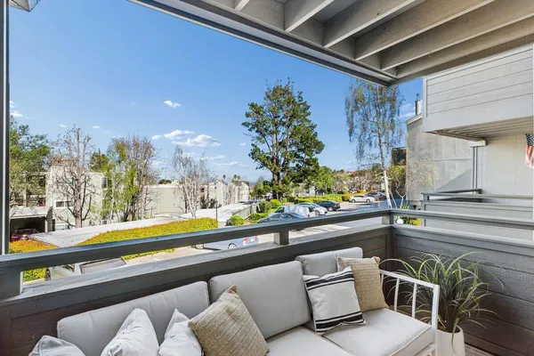 a outdoor living space with furniture and a potted plant