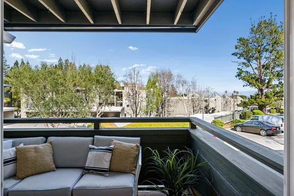 a view of swimming pool with outdoor seating