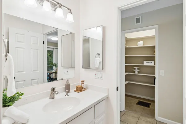 a bathroom with a sink a vanity and a mirror