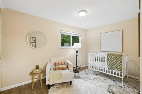 a bedroom with furniture and a window