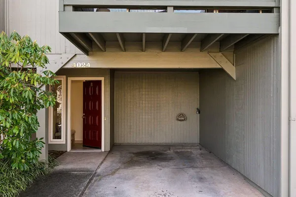 a spacious bedroom with a bed and a couch
