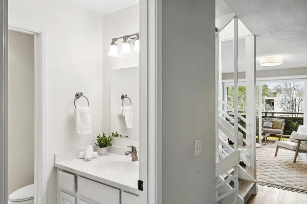 a bathroom with a bathtub shower and a sink